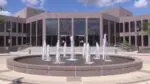 Front exterior view of Naperville City Hall with fountain going for story on council voting on non-union employee pay raises