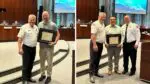 Naperville fire chief stands with life-saving heroes honored at city council meeting - each hero holding a plaque of recognition
