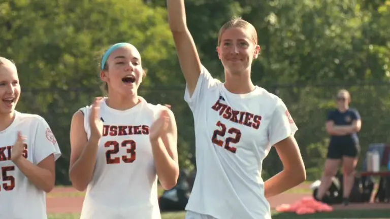 Naperville North's Claire DeCook does the lineup introductions.