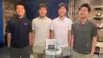 The four creators of the assistive headband, Eyerobic, built for visually-impaired swimmers, smile for a picture standing side by side.