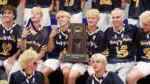 Neuqua Valley boys lacrosse holds the IHSA State fourth place trophy.