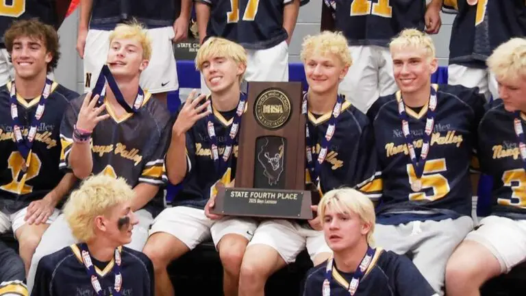 Neuqua Valley boys lacrosse holds the IHSA State fourth place trophy.