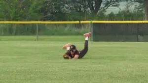 Nikolas Schaefer lays out full extension for a catch for Benet Academy Baseball.