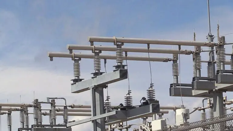 Electric posts and wires at power plant.