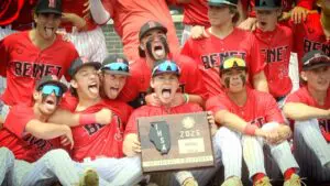 Benet baseball celebrates with the IHSA Sectional plaque after beating St. Francis