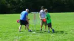 A family plays disc golf