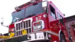 Close up low angle shot of front of Naperville fire truck for story on attic fire