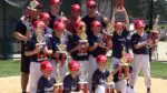 Baumgartner Construction celebrates with trophies to win the the Naperville Little League Supreme AA Championship.