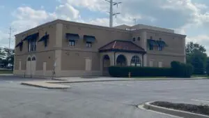Wide shot of vacant restaurant building at 844 S. Route 59 - site of future Guzman y Gomez