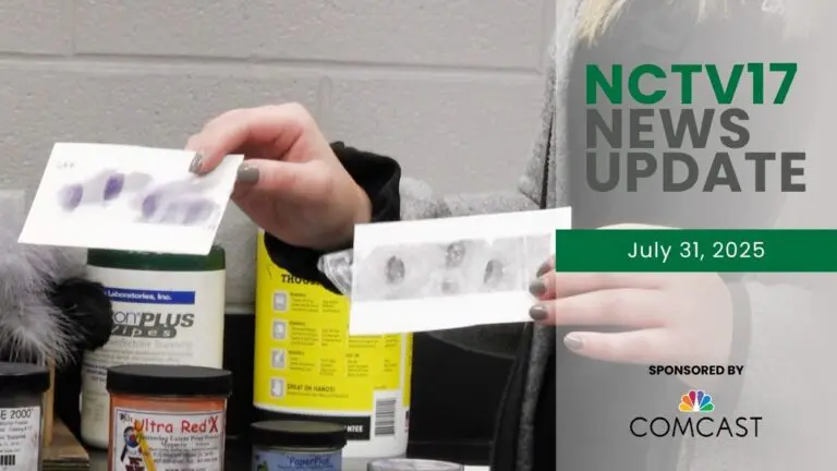 A woman holding two sheets of paper with finger prints, with the NCTV17 News Update watermark