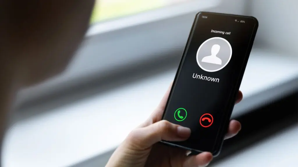 Close up of mobile phone with incoming call from unknown caller