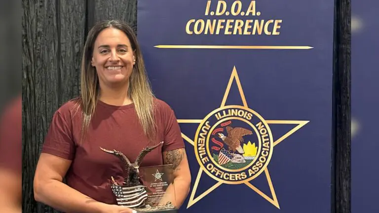 Forest Preserve District of DuPage County police officer Kim Eversole with her award