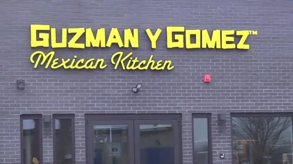 Close up of Guzman y Gomez restaurant sign at first Naperville location