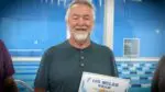 Naperville’s Greg Fyksen smiles with the plaque after completing the YMCA 100 Mile Swim Club Challenge in 94 days.