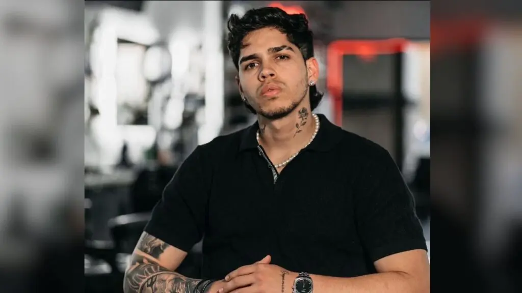 A picture of Manuel Jose Rosales Yajure with the hands together wearing a black shirt. He is the Streamwood man who died in a suspected drowning incident at Naperville's Centennial Beach.