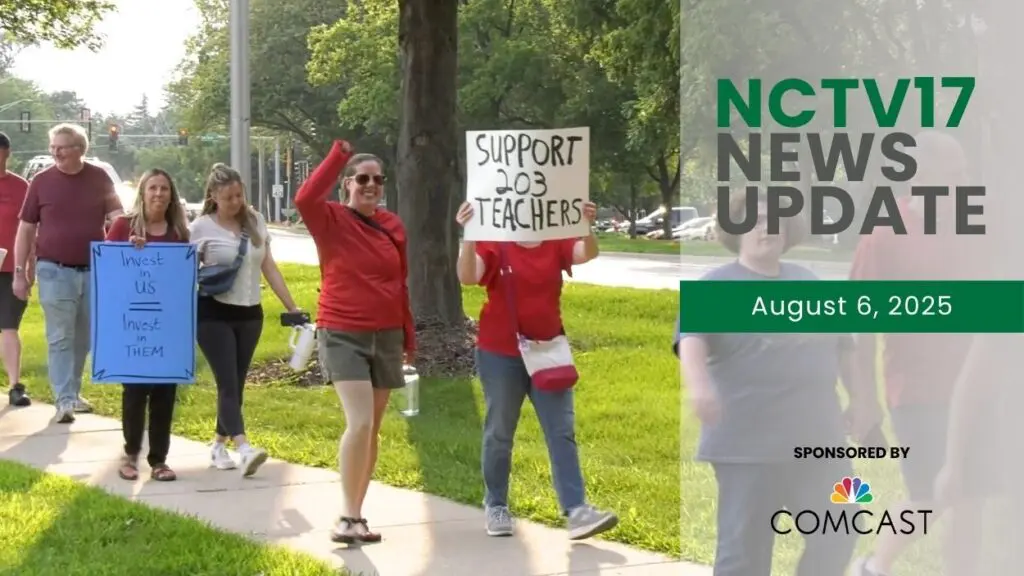 People wearing red and participating in the rally for a fair contract for Naperville School District 203 teachers.