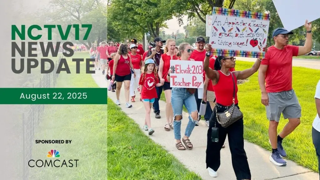 Naperville D203 teachers and community members holding signs as they rally