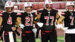Benet football captains walkout to midfield against Hillcrest.