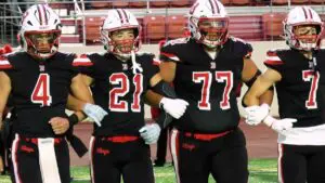 Benet football captains walkout to midfield against Hillcrest.
