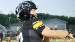 Metea Valley football quarterback Charles Larson warms up before taking on Downers Grove South.