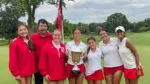Naperville Central girls golf team holds the Vern McGonagle City Championship trophy on the 18th green at Naperville Country Club.