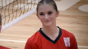 Naperville Central girls volleyball player looks at her team in between plays against Plainfield North.