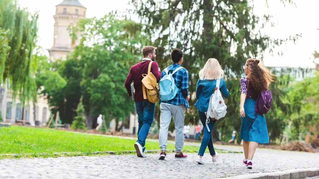 Naperville PD sparks conversation on college safety. 4 students walking on campus