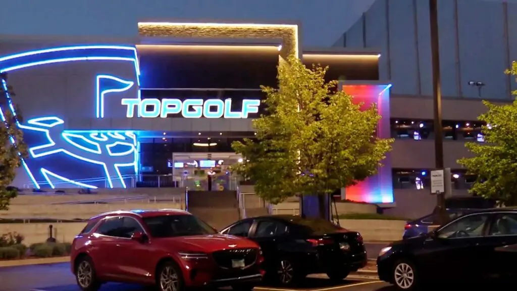 Photo of the Naperville Topgolf building at night