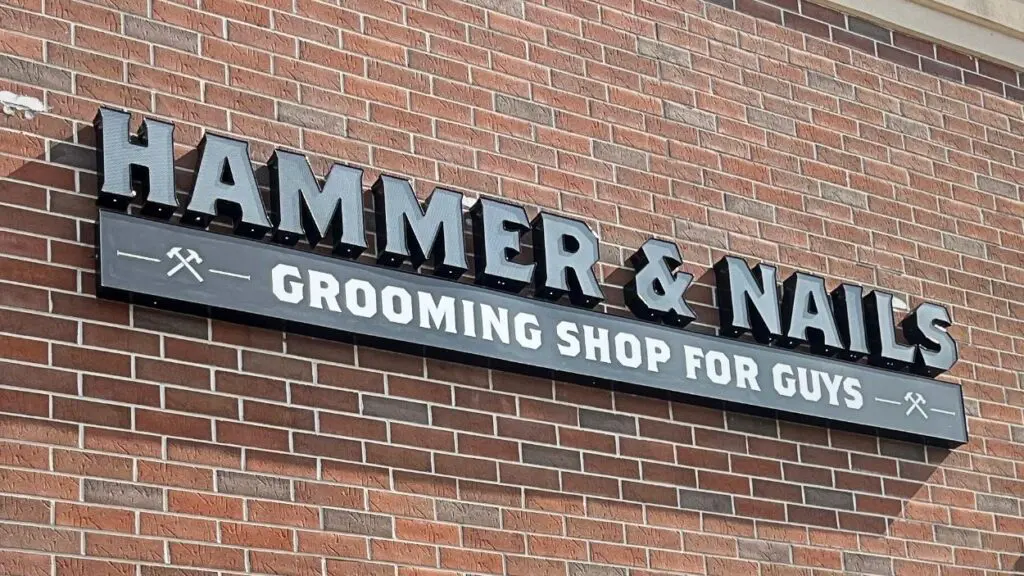 The Hammer and Nails Grooming Shop storefront sign.