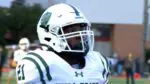 New Trier Football player contemplates before a game.