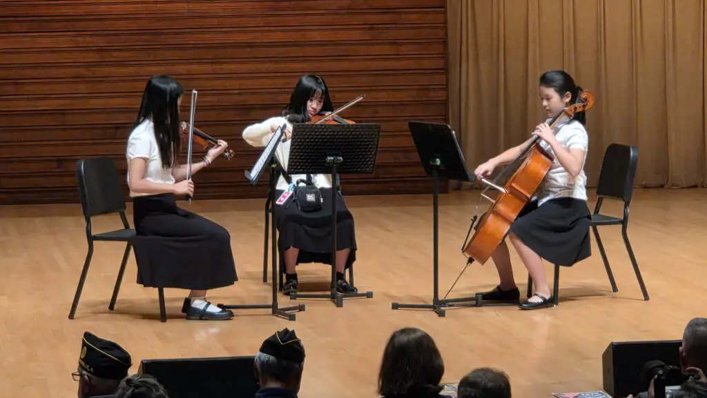 A trio of OPUS students perform on the stage of the Wentz Concert Hall
