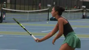 Naperville North girls tennis slips past Waubonsie Valley as Lydia Parranto gets ready for a return