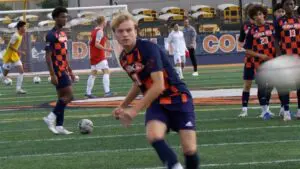 Josh Pederson kicks a ball on goal during warmups for Naperville North boys soccer.