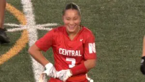 Malia Shen smiles on the field for Naperville Central.