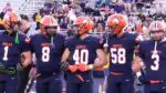 Naperville North hands Metea their first loss of the season as they join arms.