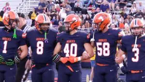 Naperville North hands Metea their first loss of the season as they join arms.