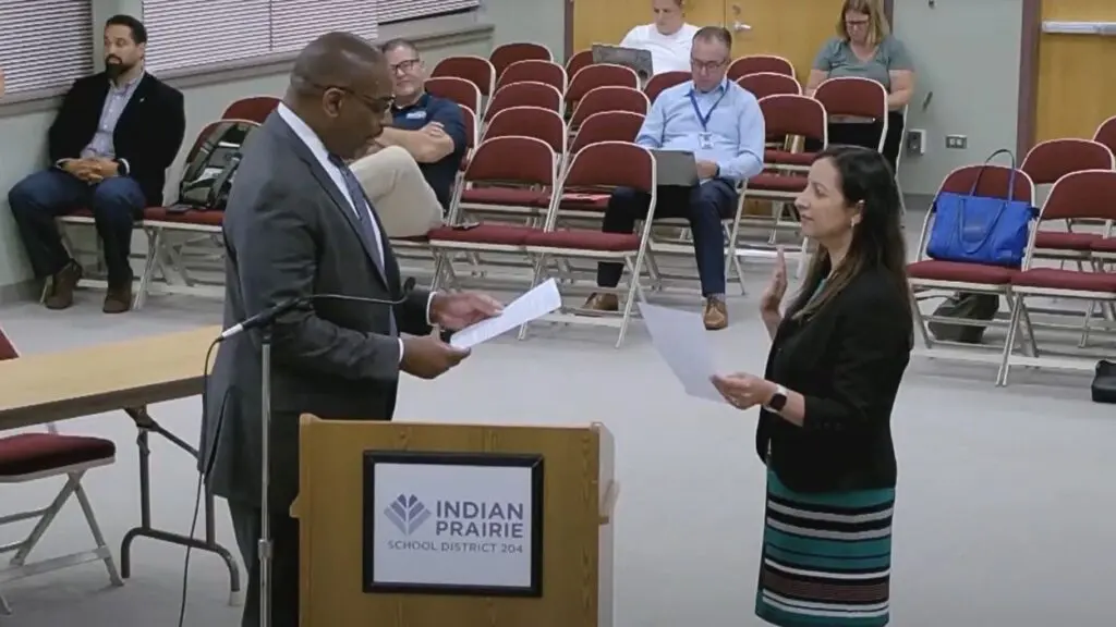 IPSD 204 Superintendent Dr Adrian Talley swears in Natasha Grover at board meeting