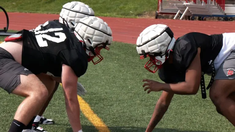 North Central college football players lining up on defense