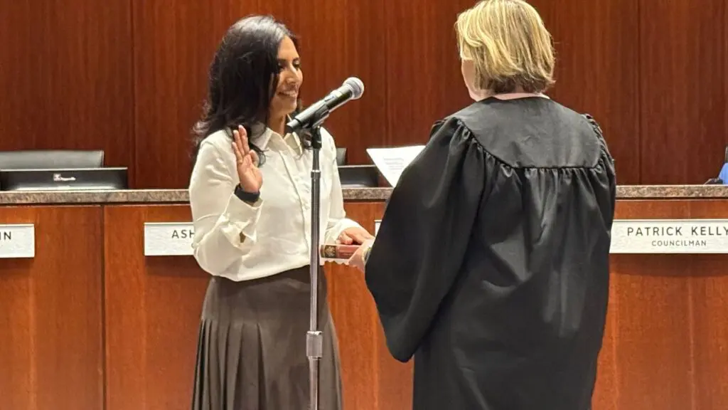 Supna Jain sworn in as new member of Naperville City Council. picture of Jain being sworn in.