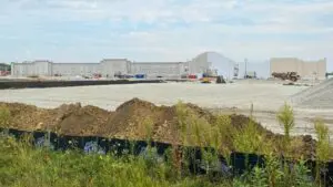 Wide shot of Woodman's Food Market under construction in Plainfield with dirt pile in foreground