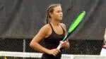 2025 York Girls Tennis sectional title goes to Wheaton Warrenville South as Lepsi stands on the court.