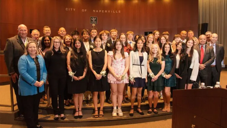 22 teens who won Youth Service Award pose for photo in council chambers