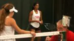 Central girls tennis wins tiebreaker as Kistler talks to the coach and Parameswar prepares to play.