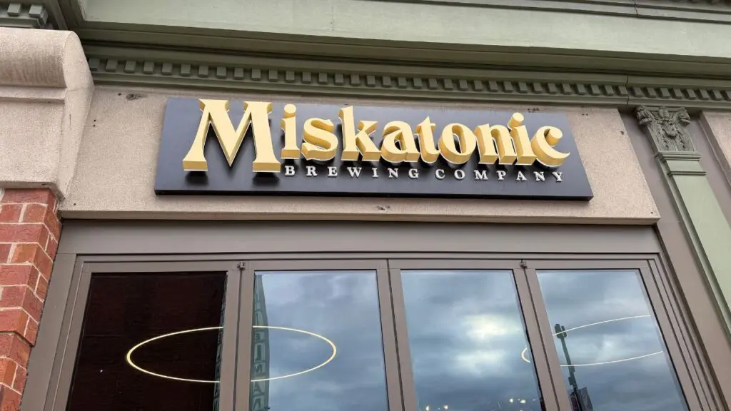 Close up of Miskatonic Brewing Company sign at Miskatonic Brewing Craft Kitchen in downtown Naperville