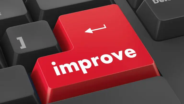 Red improve key on a keyboard with a white arrow on it