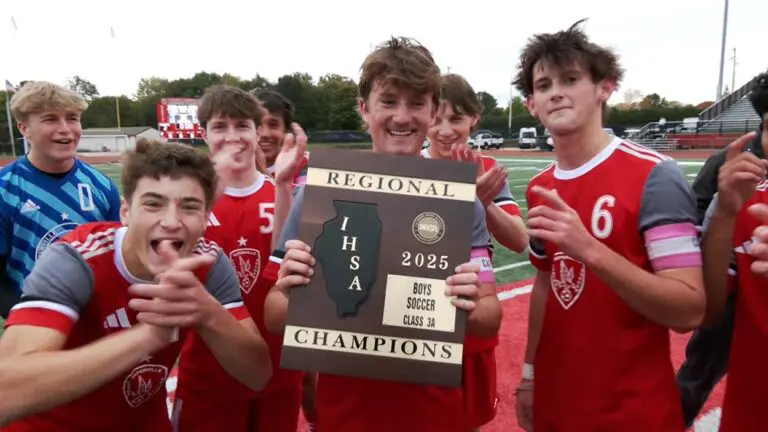 Naperville Central with boys soccer regional plaque