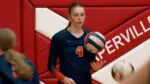 Naperville North comes back as Grace Anderson prepares to serve.