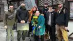 Naperville resident Ausra Tallat-Kelpsa Di Raimondo holding flowers and standing with group in Ukraine