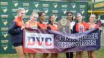 Naperville North runs away with the 2025 DVC girls cross country championship as the team poses with the plaque
