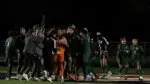 Waubonsie Boys Soccer earns victory as their players celebrate.